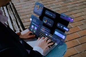Fractional marketing leader working remotely on a laptop with digital dashboards, analytics, and performance metrics displayed in an augmented interface.