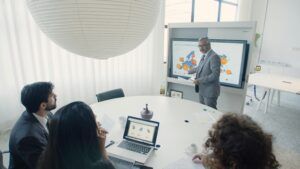 Business owner reviewing growth metrics with fractional CMO services support