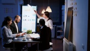Team brainstorming digital strategies with the help of fractional marketing services